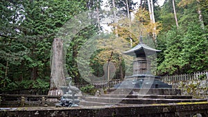Beautiful scene of tomb of Shogun Tokugawa Ieyasu at Toshogu Jinja Shrine on refreshing trees, background