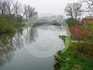 Beautiful scene Water reflect Lakeside in the green park of Brugge