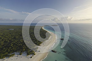 Beautiful scenery of beach, ocean, wave, and island. Beach and island illustration.