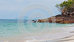 Beautiful scenery on a beach with sea waves at Koh Chang, Thailand.Clear water of sea waves on the beautiful beach.