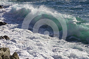 Beautiful scenery of crazy sea waves splashing in Varazze, Italy