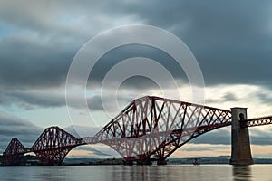 Beautiful scenery of the famous Forth Bridge railway in Queensferry, UK under a cloudy sky