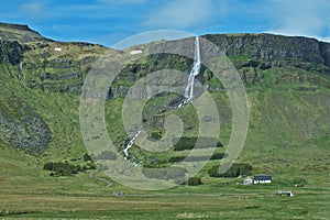 Beautiful scenery of green hills with waterfall Iceland