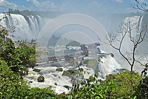 Beautiful scenery of Iguacu Iguazu falls view of bridge with people border of Brazil and Argentina