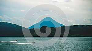 Beautiful scenery of jet skis on Lake Ikeda at the Kaimon-Dake volcano in Japan