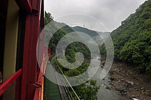 Beautiful scenery of the Katsura river seen from the red wagons of the Sagano Scenic Railway