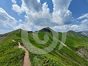 Beautiful scenery of a mountain ridge under the blue cloudy sky in Slovakia