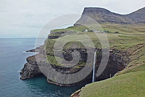 Beautiful scenery of Mulafossur Waterfall and Gasadalur village Vagar island Faroe islands