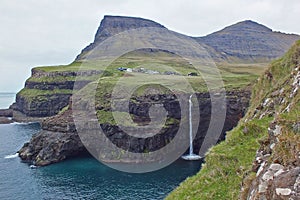 Beautiful scenery of Mulafossur Waterfall and Gasadalur village Vagar island Faroe islands