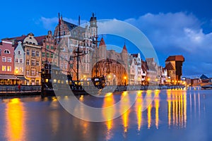 Beautiful scenery of the old town in Gdansk over Motlawa river at dawn, Poland