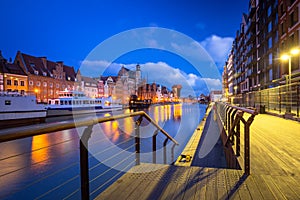 Beautiful scenery of the old town in Gdansk over Motlawa river at dawn, Poland