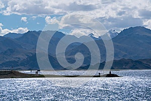 Beautiful scenery of Pangong Tso lake with  blue sky  white clouds in China side