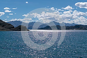 Beautiful scenery of Pangong Tso lake with  blue sky  white clouds in China side