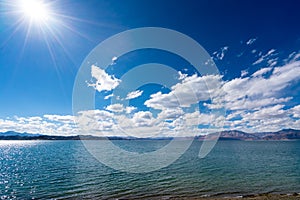 Beautiful scenery of Pangong Tso lake with  blue sky  white clouds in China side