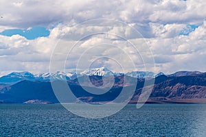 Beautiful scenery of Pangong Tso lake with  blue sky  white clouds in China side