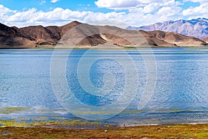 Beautiful scenery of Pangong Tso lake with  blue sky  white clouds in China side