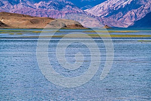 Beautiful scenery of Pangong Tso lake with  blue sky  white clouds in China side