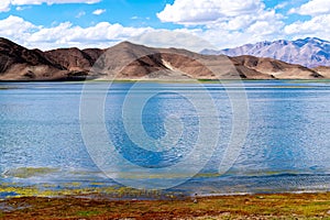 Beautiful scenery of Pangong Tso lake with  blue sky  white clouds in China side