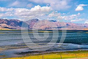 Beautiful scenery of Pangong Tso lake with  blue sky  white clouds in China side