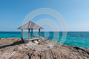 Beautiful scenery pavilion on rock coast with blue sea ocean water and sky, scenic tropical outdoor landscape coastline travel in