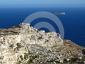 Beautiful scenery of rocky cliffs on the sea coast on the island of Filfla in Malta