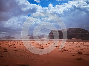 Beautiful Scenery Scenic Panoramic View Red Sand Desert and Ancient Sandstone Mountains Landscape in Wadi Rum, Jordan during a San