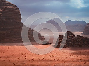 Beautiful Scenery Scenic Panoramic View Red Sand Desert and Ancient Sandstone Mountains Landscape in Wadi Rum, Jordan during a San
