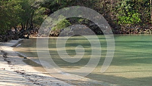 Beautiful scenery and Soft wave on sand beach at Koh Ngam near Koh Chang Islands,Trat, Thailand.