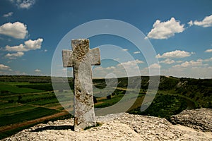 Beautiful scenery with a stone cross