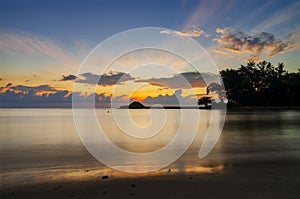 Beautiful scenery against sunrise background at Kuala Ibai Beach photo