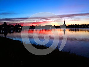 The beautiful scenery of sunset by the lake in the evening  with the beautiful blue and orange sunlight sky