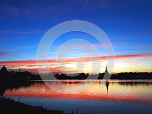 The beautiful scenery of sunset by the lake in the evening