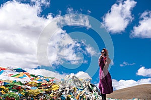 The Beautiful Scenery: Woman and Prayer Flags