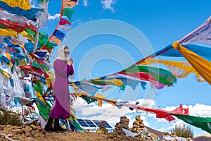 The Beautiful Scenery: Woman and Prayer Flags