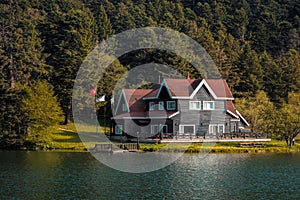 Beautiful scenery of wooden lake house inside the Abant Golcuk National Park in Bolu