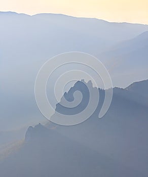 Beautiful scenic golden autumn aerial sunshine landscape of Sobor Skala Rock silhouette viewed from Chernogor mountain top at suns