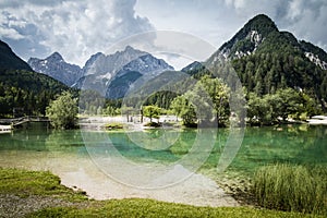 Beautiful scenic lake jasna in summertime, kranjska gora, slovenia photo