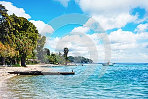 Beautiful scenic landscape with a boat in the bay near the beach in Nydri, Lefkada, Greece. Stunning amazing charming places.