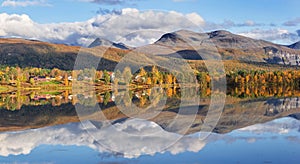 beautiful scenic landscape with mountain and autumnal forest