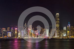 Beautiful scenic night view of victoria habour and building on hong kong island. Landmark of hong kong with blurred and defocused