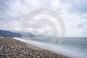 Beautiful scenic of ocean with sprawling stone covered beach