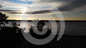 Beautiful scenic outlook at dusk.trees,sea and sky at peace