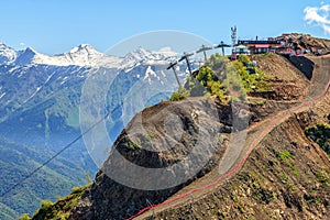 Beautiful scenic summer landscape of Caucasus mountain peaks with snow tops at Gorky Gorod mountain ski resort in Sochi, Russia on