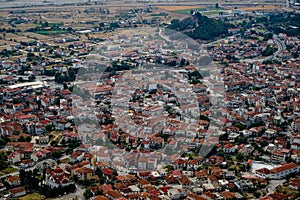 Beautiful scenic townscape view of ancient red roof buildings, urban street and space in Kalambaka from Meteora monasteries rock