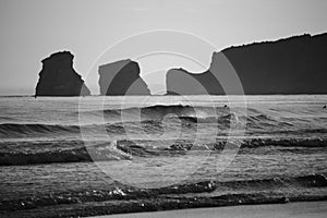 Beautiful scenic view of beach of hendaye with breaking waves in black and white