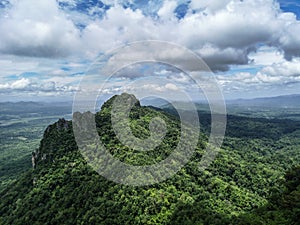 Beautiful scenic view of green jungle peak with amazing cloudy blue sky