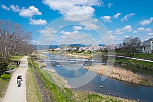 Beautiful scenic view from Kamo River Kamo-gawa in Kyoto, Japan. The riverbanks are popular walking