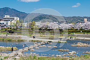 Beautiful scenic view from Kamo River Kamo-gawa in Kyoto, Japan. The riverbanks are popular walking