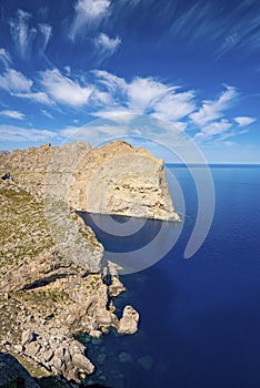 Beautiful scenic view of Mediterranean seascape by rocky cliff against blue sky