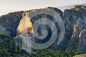 Beautiful scenic view, Orthodox Monastery of Rousanou St. Barbara, immense monolithic pillar, green and yellow foliage